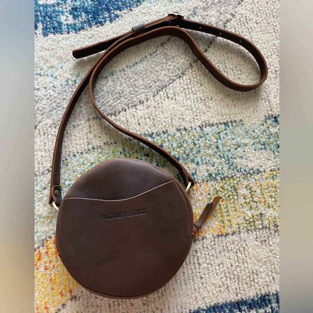 Real leather crossbody bag. Will fit a phone and more! Slight wear (picture 2).
